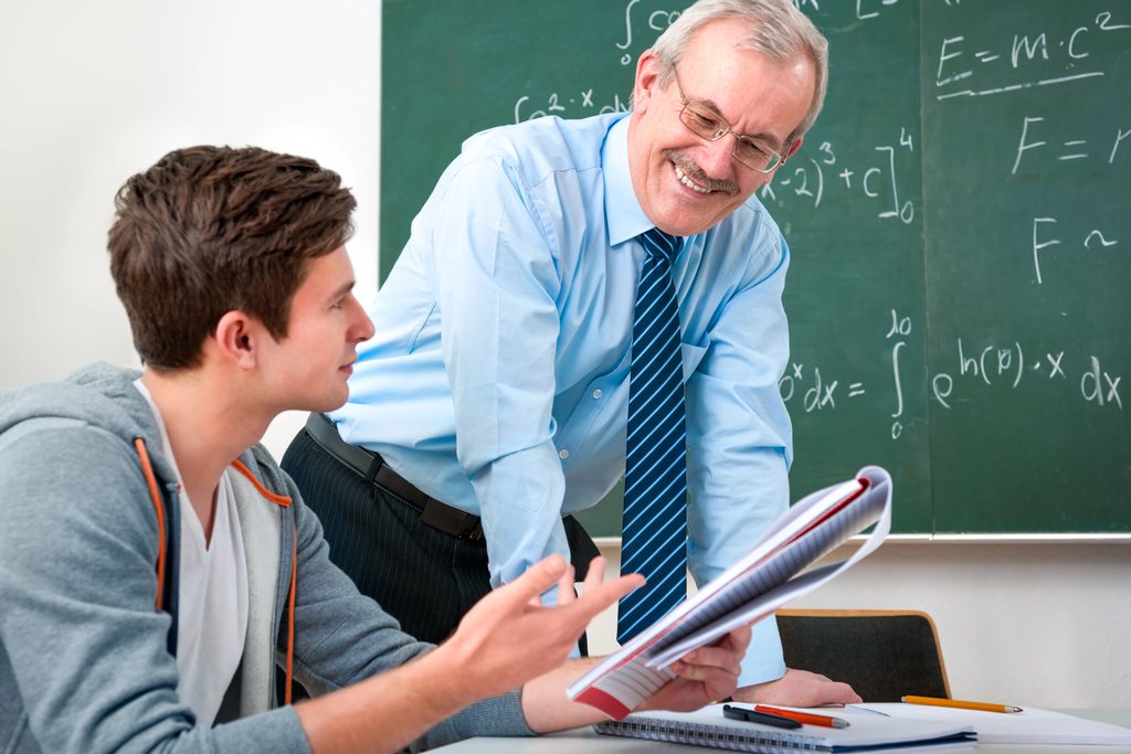college student talking to professor